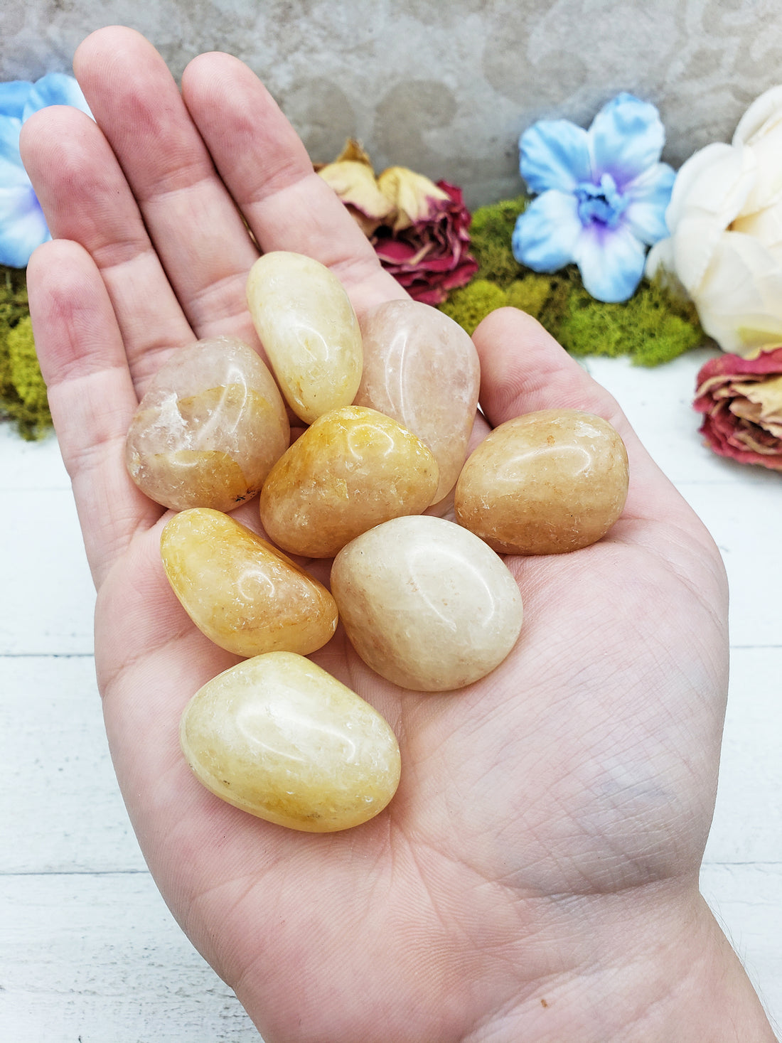 gold quartz crystals in hand
