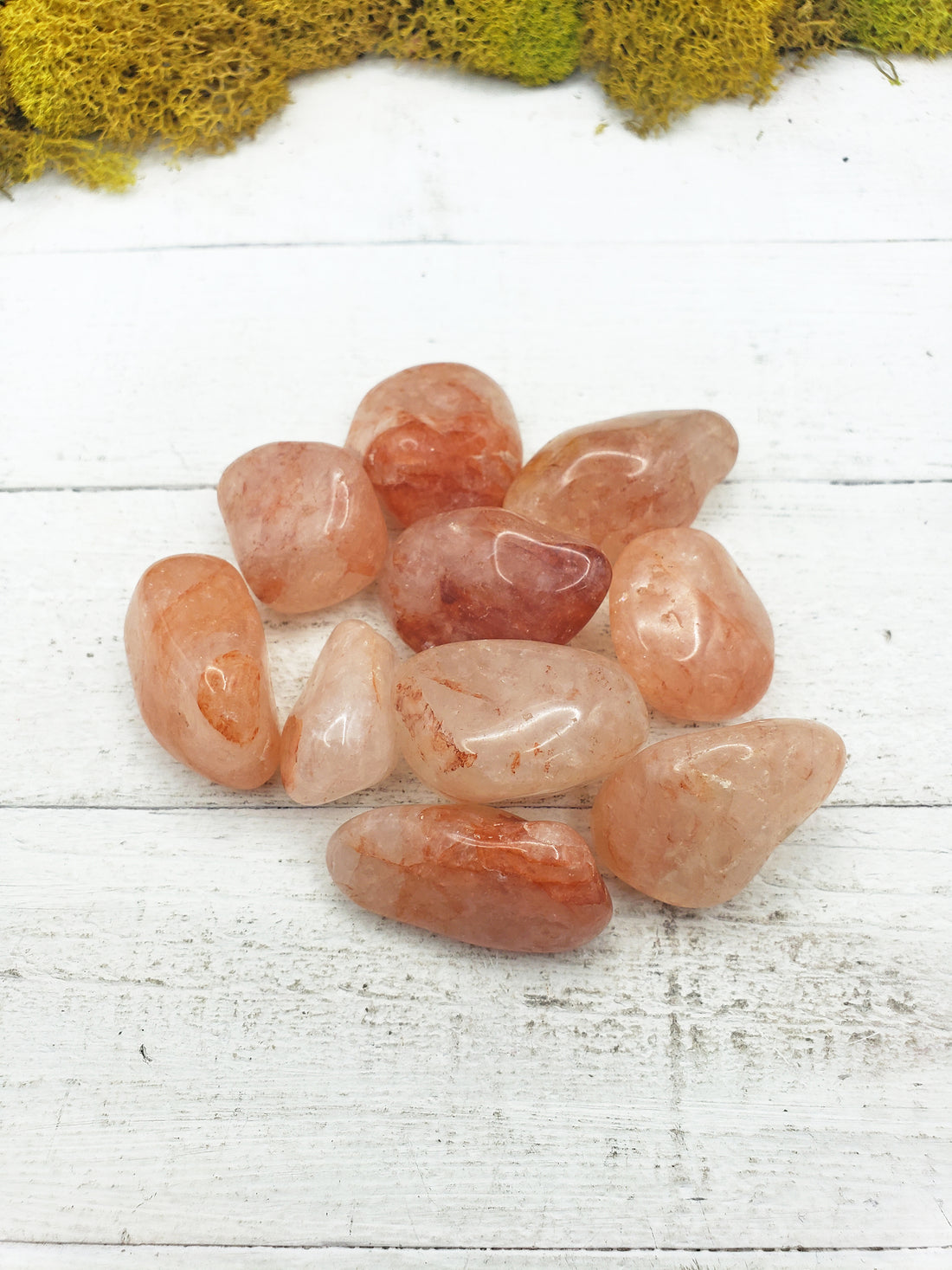 light strawberry quartz stones on board