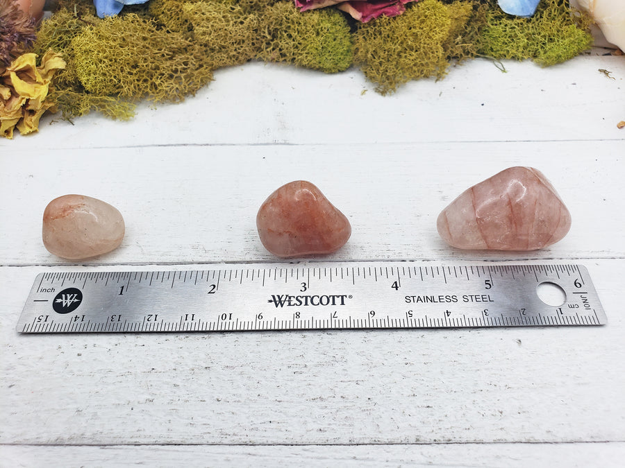 light strawberry quartz stones by ruler