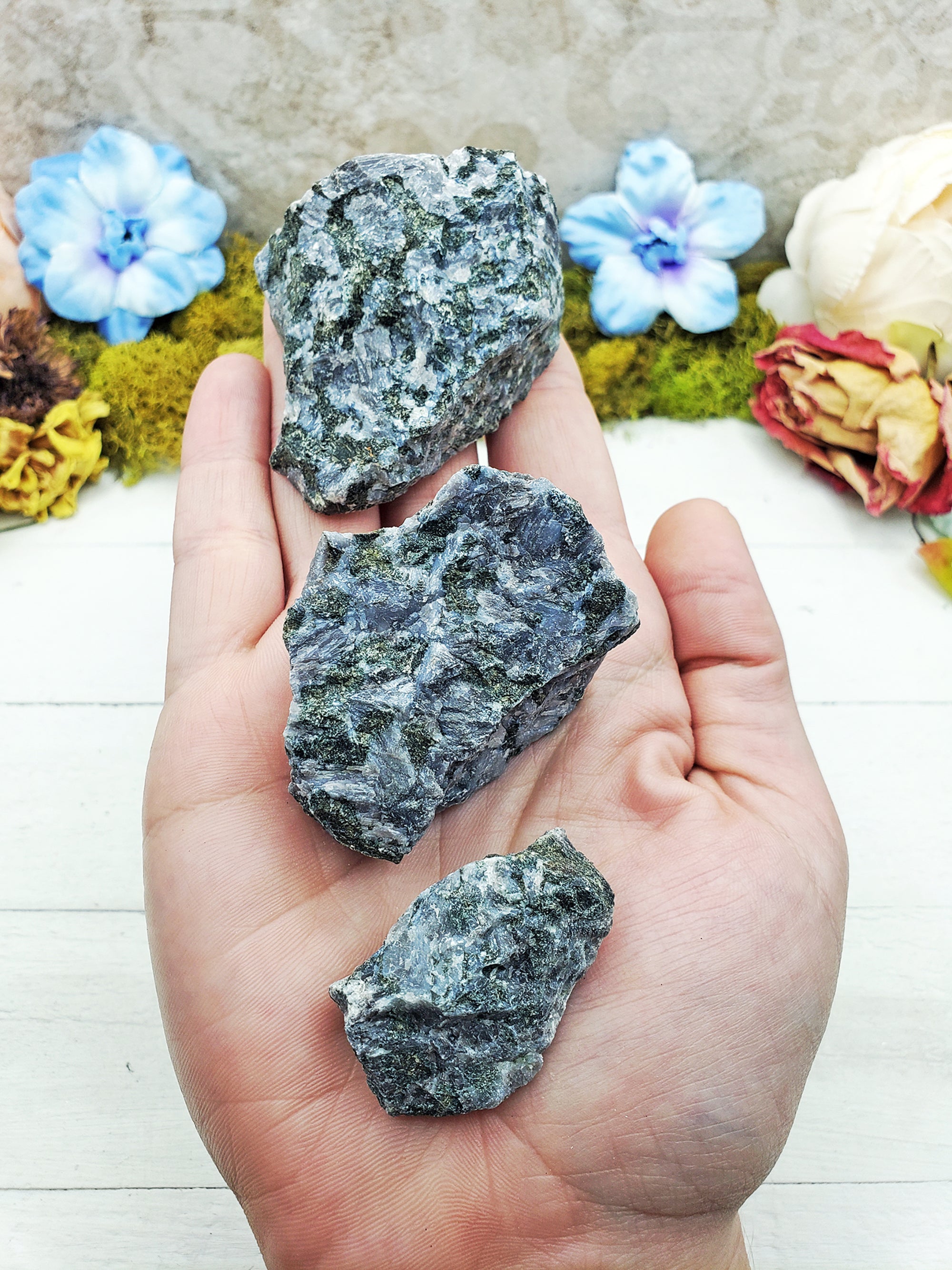 Merlinite Stones in hand