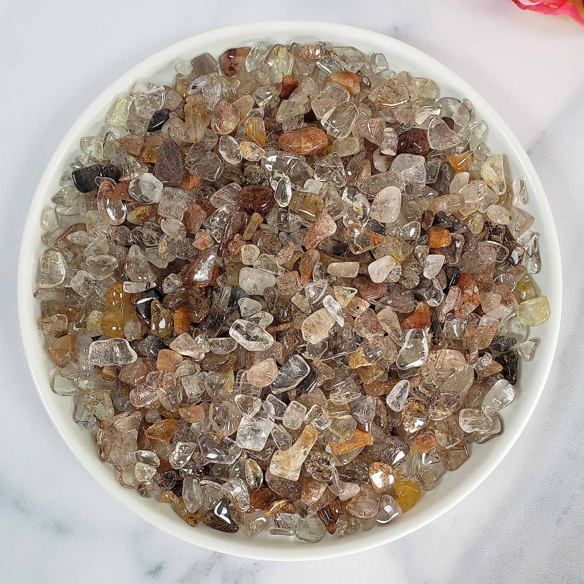 Mixed Rutilated Quartz Crystal Natural Gemstone Chips By the Ounce - in White Ceramic Bowl