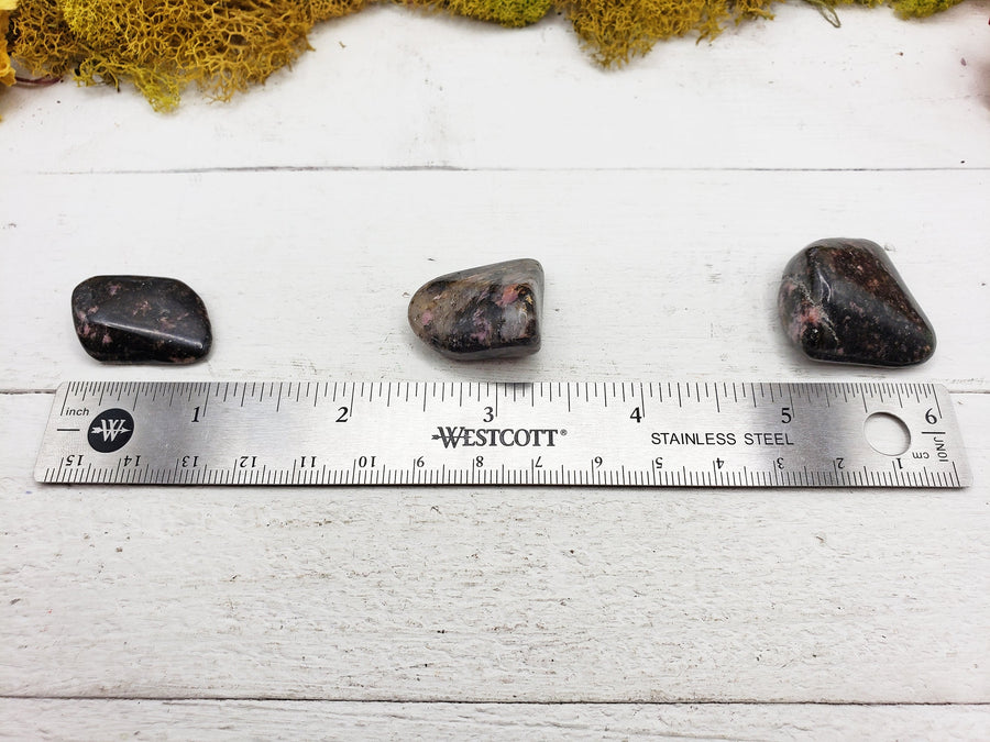 rhodonite quartz stones by ruler