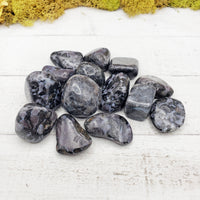 merlinite indigo gabbro stones on board