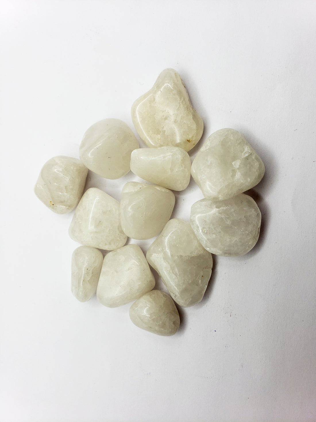 milky quartz stones on white background