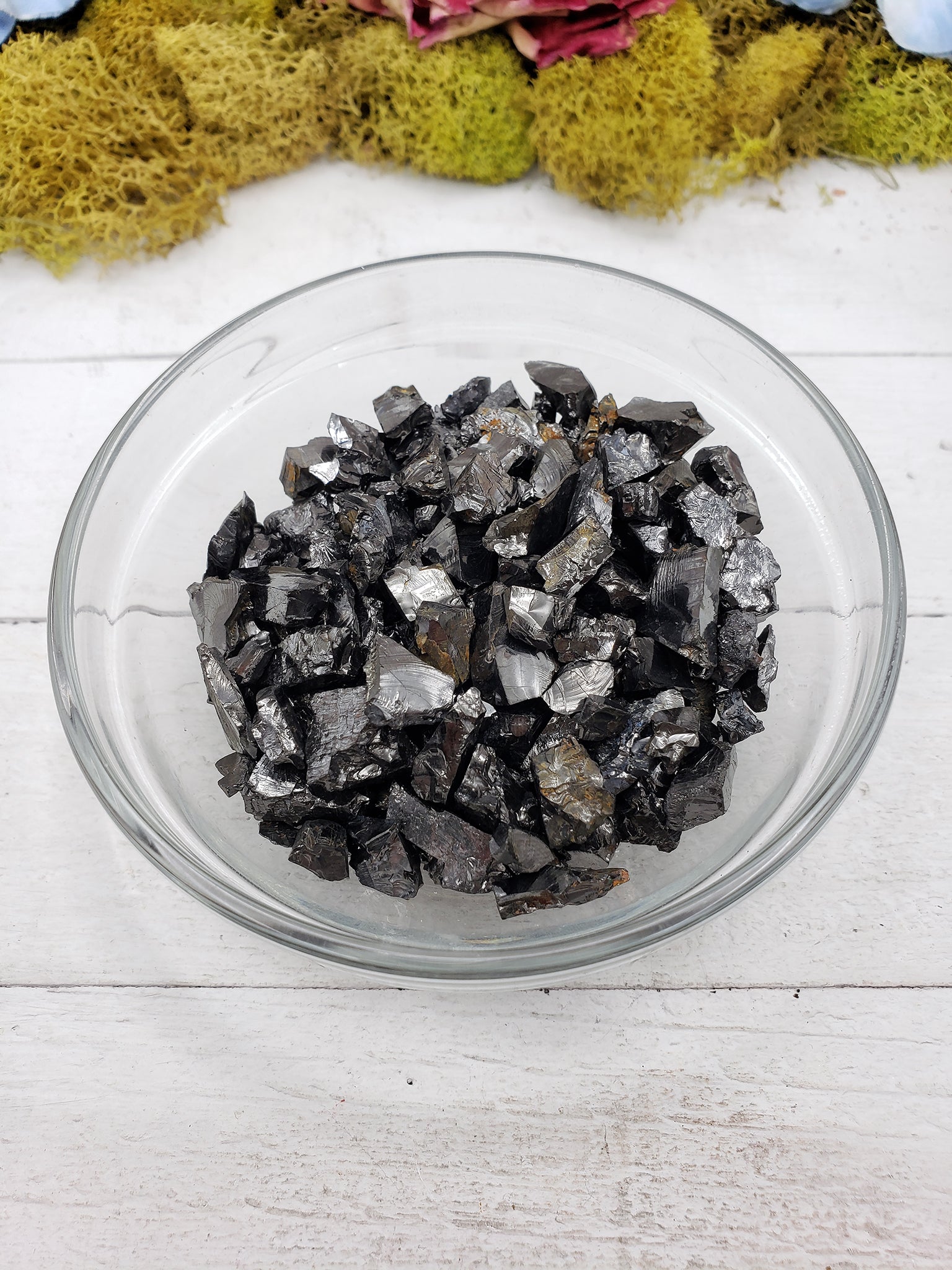 shungite stone pieces in glass bowl