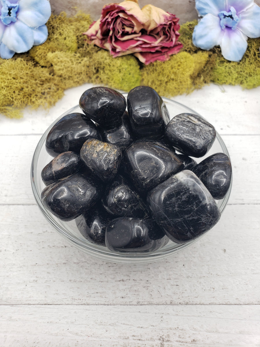 black tourmaline crystals in glass bowl