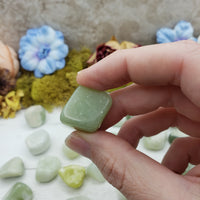 new jade stone between fingers