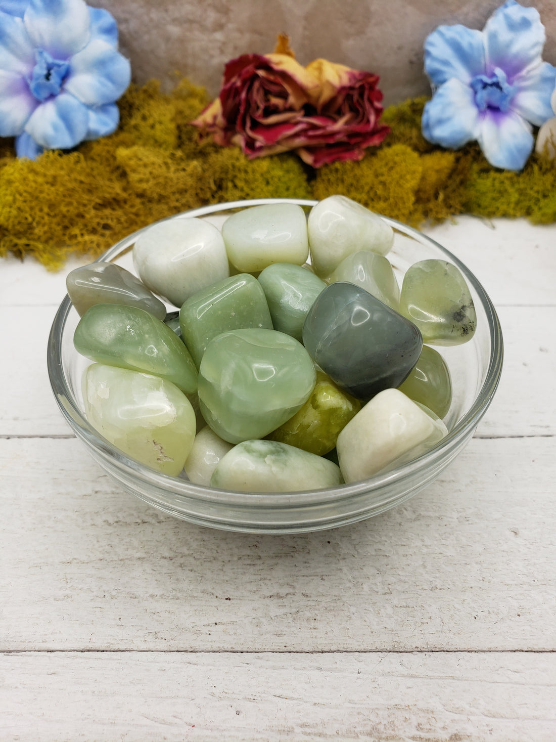 new jade stones in glass bowl