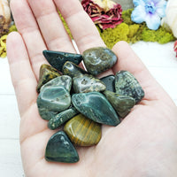 ocean jasper stones in hand