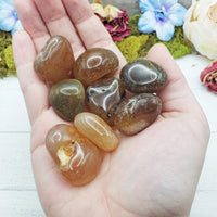 natural agate crystals in hand