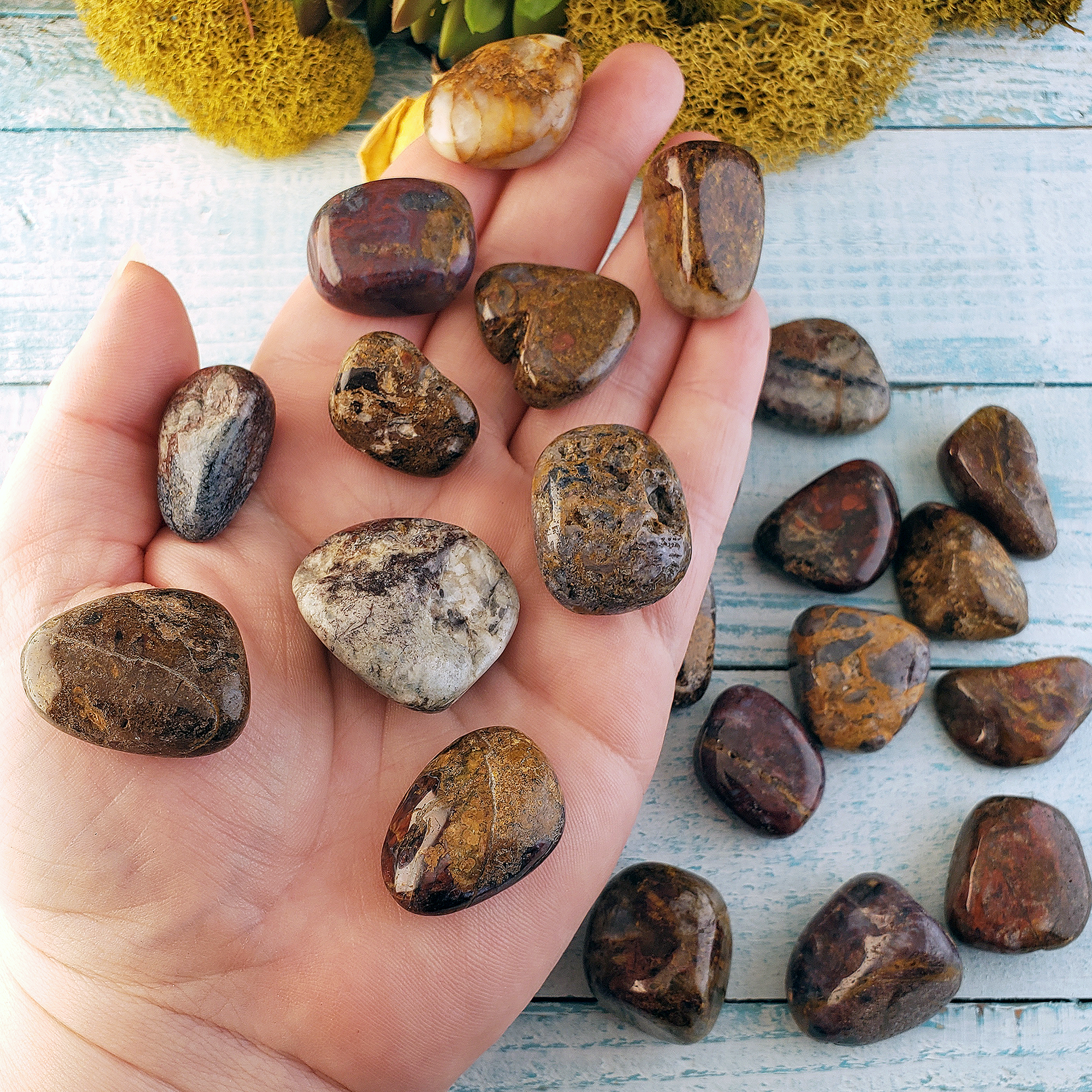 Pietersite Stone Natural Gemstone Semi-Tumbled Crystal - In Hand Above Other Stones