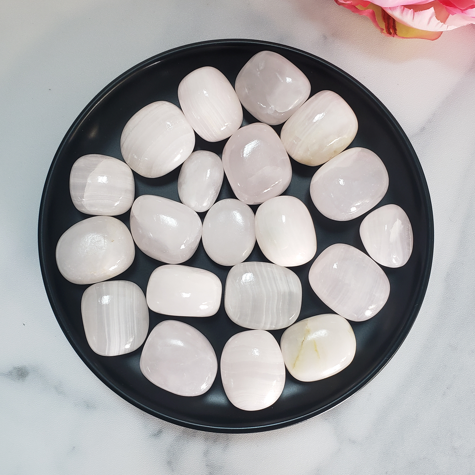 Pearl Pink Calcite Crystal Natural Tumbled Stone - Pastel Pink Calcite in Black Ceramic Bowl