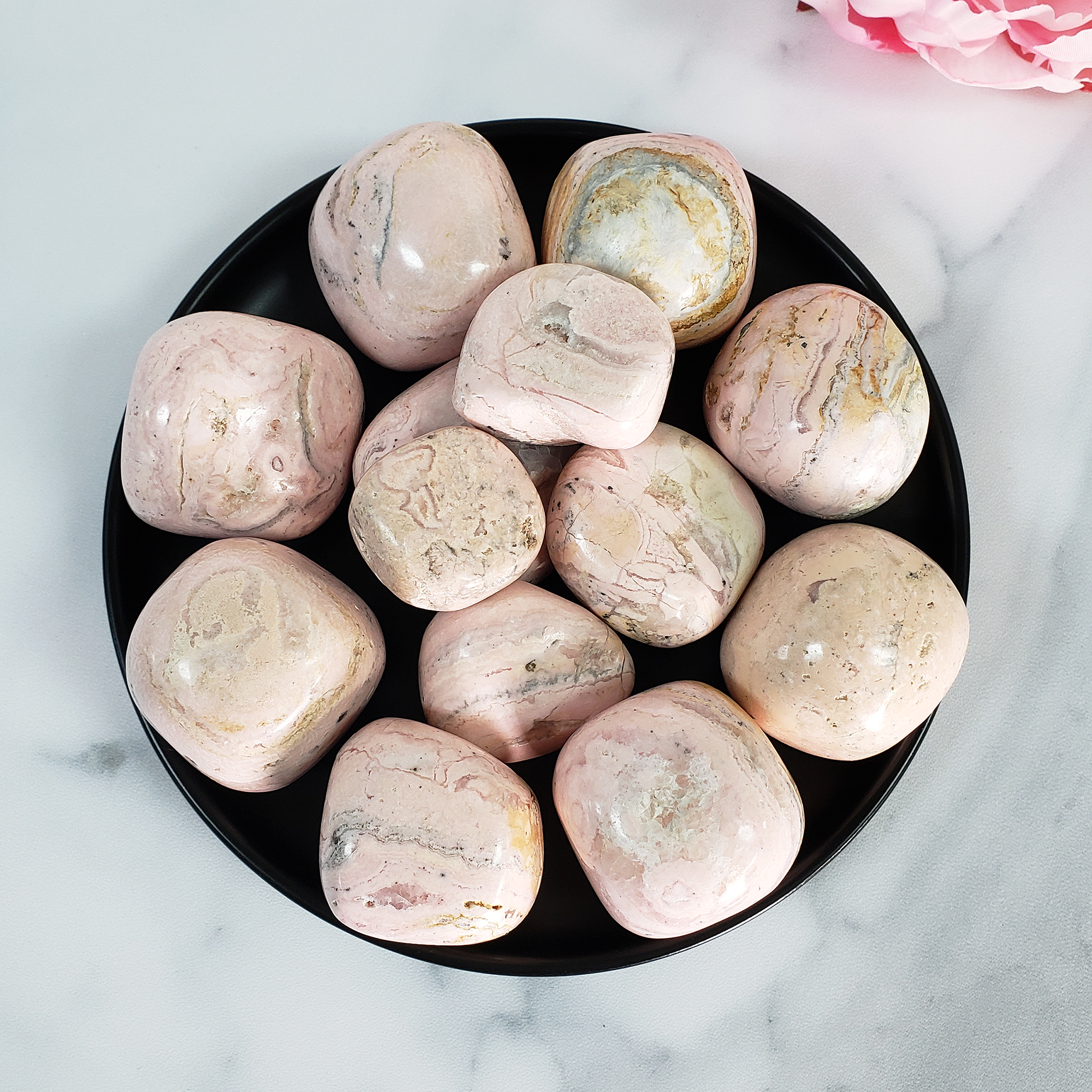 Pink Rhodochrosite Crystal Natural Gemstone Tumbled Stone | Multiple Sizes - Seen from Above in Black Ceramic Dish