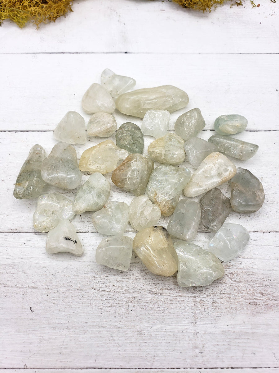 tumbled aquamarine stone pieces on display