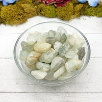tumbled aquamarine in glass bowl