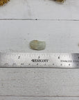 ruler comparing size of 3 tumbled aquamarine stones