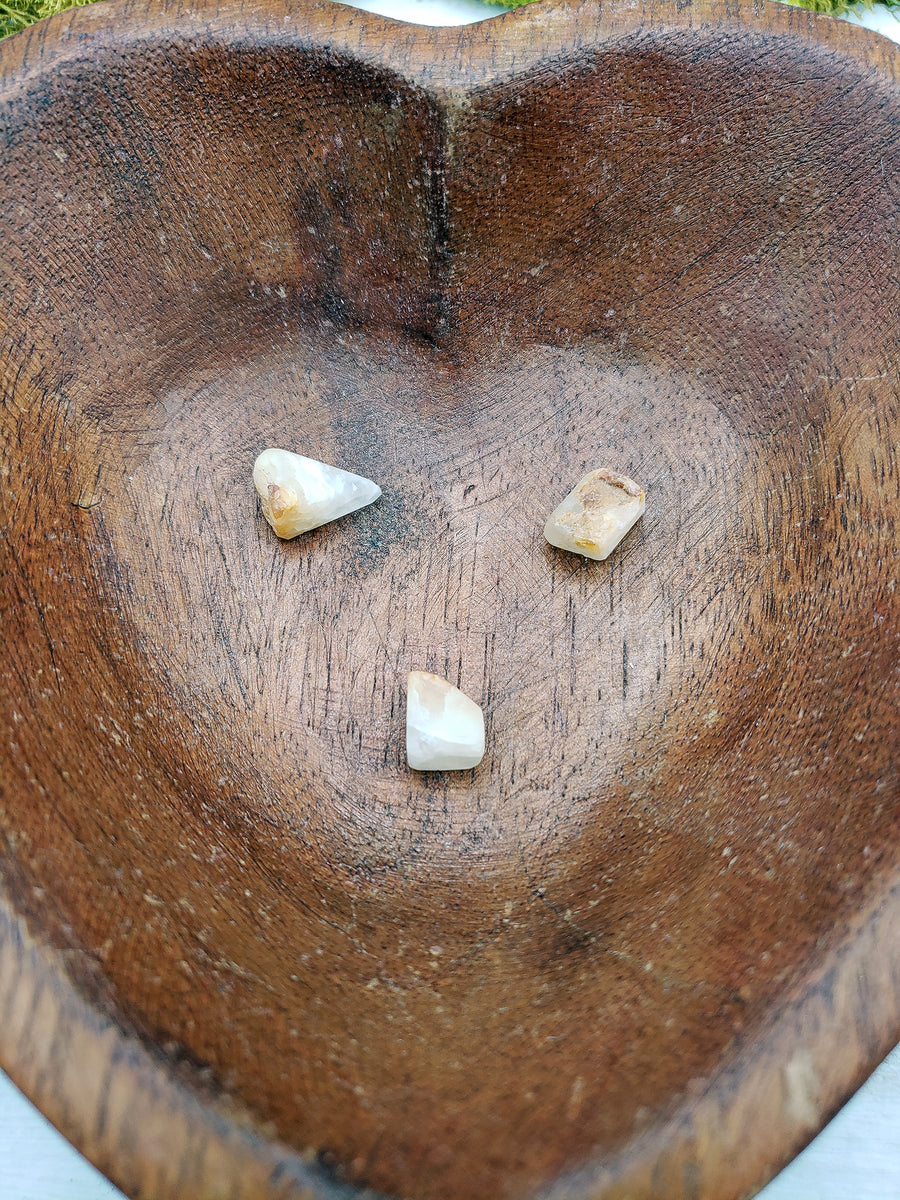 wooden heart bowl with phenacite pieces