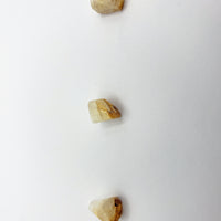 phenacite crystal pieces on white background