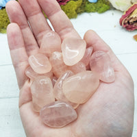 Pink Girasol Quartz Stones in hand