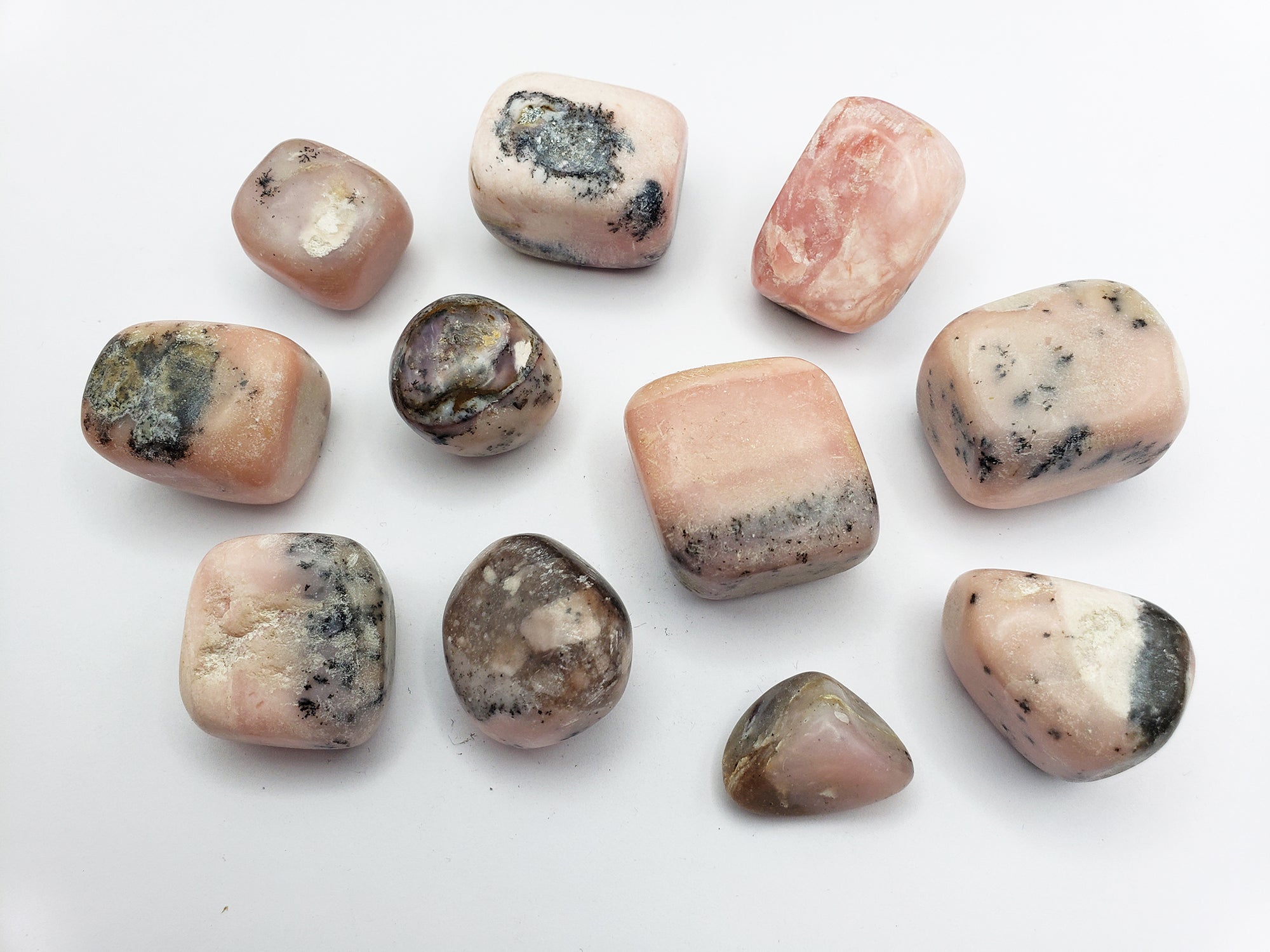 Pink Opal stones on white background