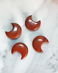 Red Jasper Natural Gemstone Crescent Moon Carving Fidget Stone - Red Jasper Stone Crystal Moons on Tile