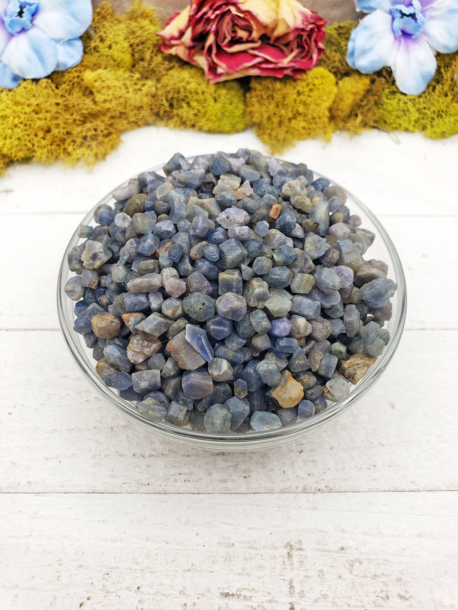 sapphire stones in glass bowl