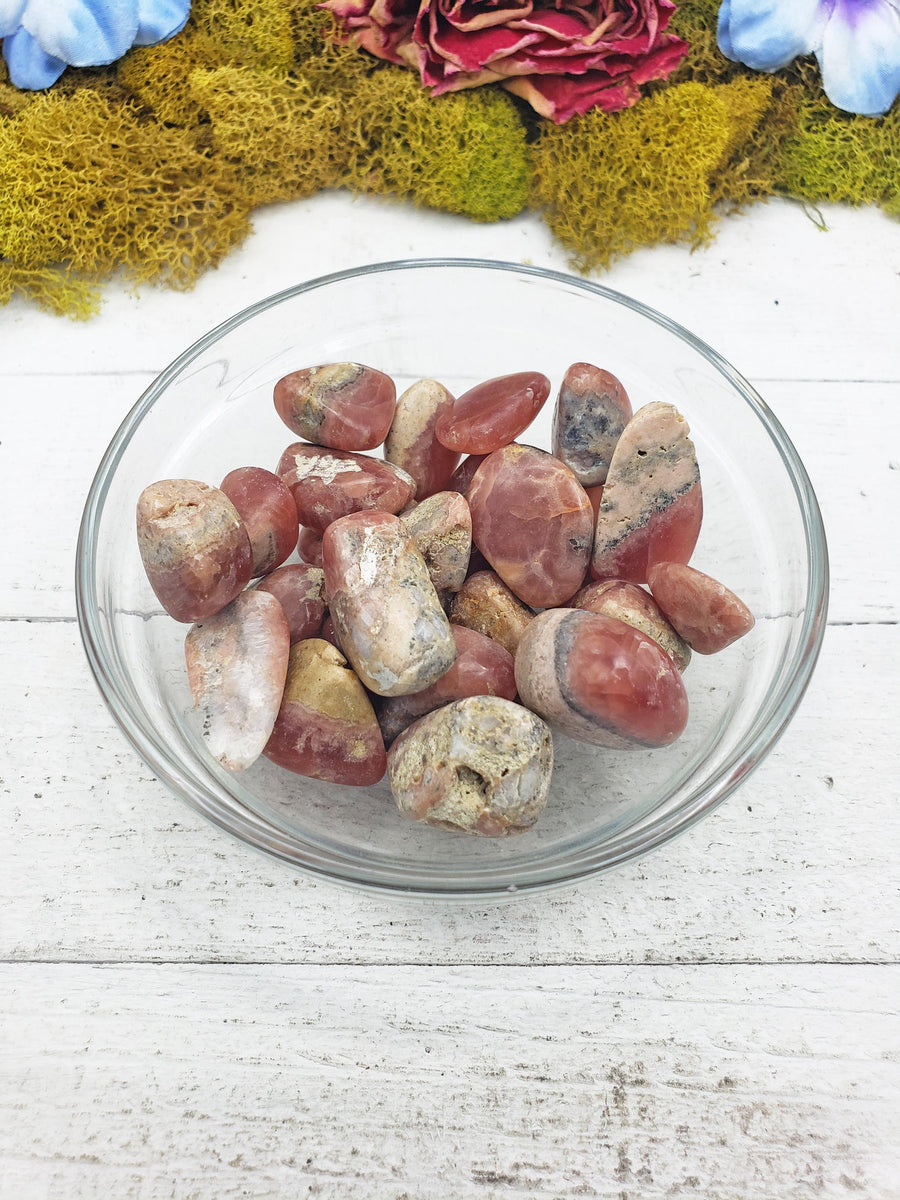 rhodocrosite crystals in glass bowl