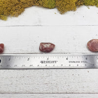 rhodocrosite crystals on ruler