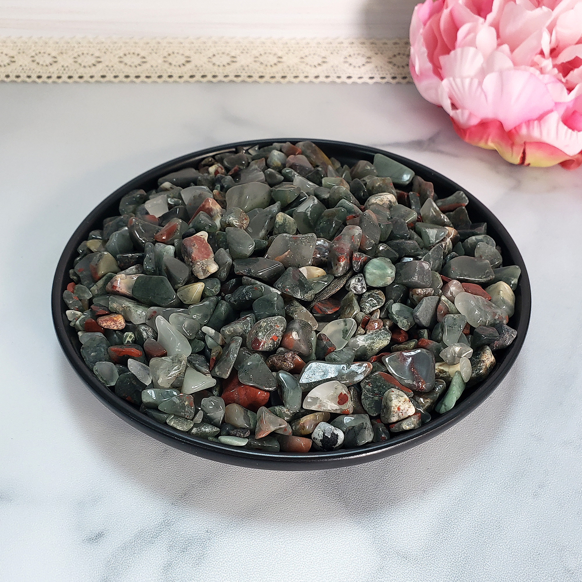 Seftonite Bloodstone Natural Gemstone Chips By the Ounce - Bloodstone Crystal Chips on Black Ceramic Plate