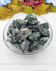 tumbled seraphinite stones  in glass bowl
