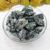 tumbled seraphinite stones  in glass bowl
