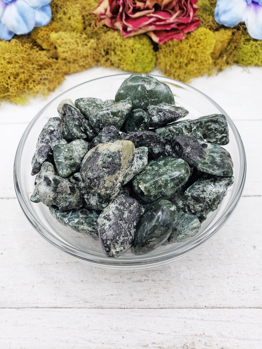 tumbled seraphinite stones  in glass bowl