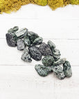 tumbled seraphinite stones  on board