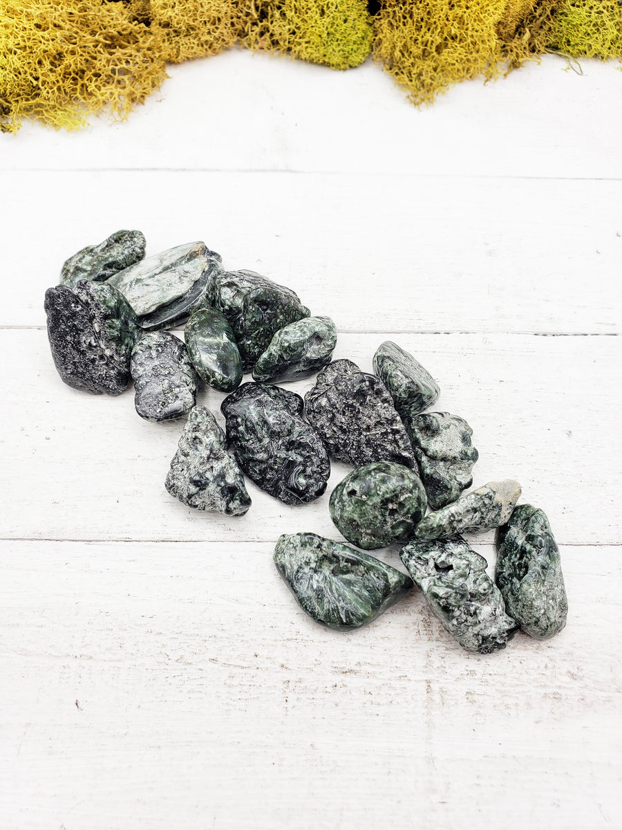tumbled seraphinite stones  on board