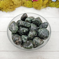 seraphinite stone in glass bowl