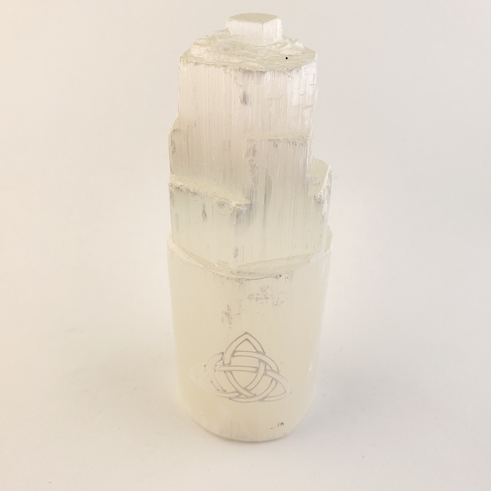 White Selenite Crystal Tower - Engraved with Triquetra - On White Background