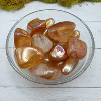 tangerine aura quartz in glass bowl