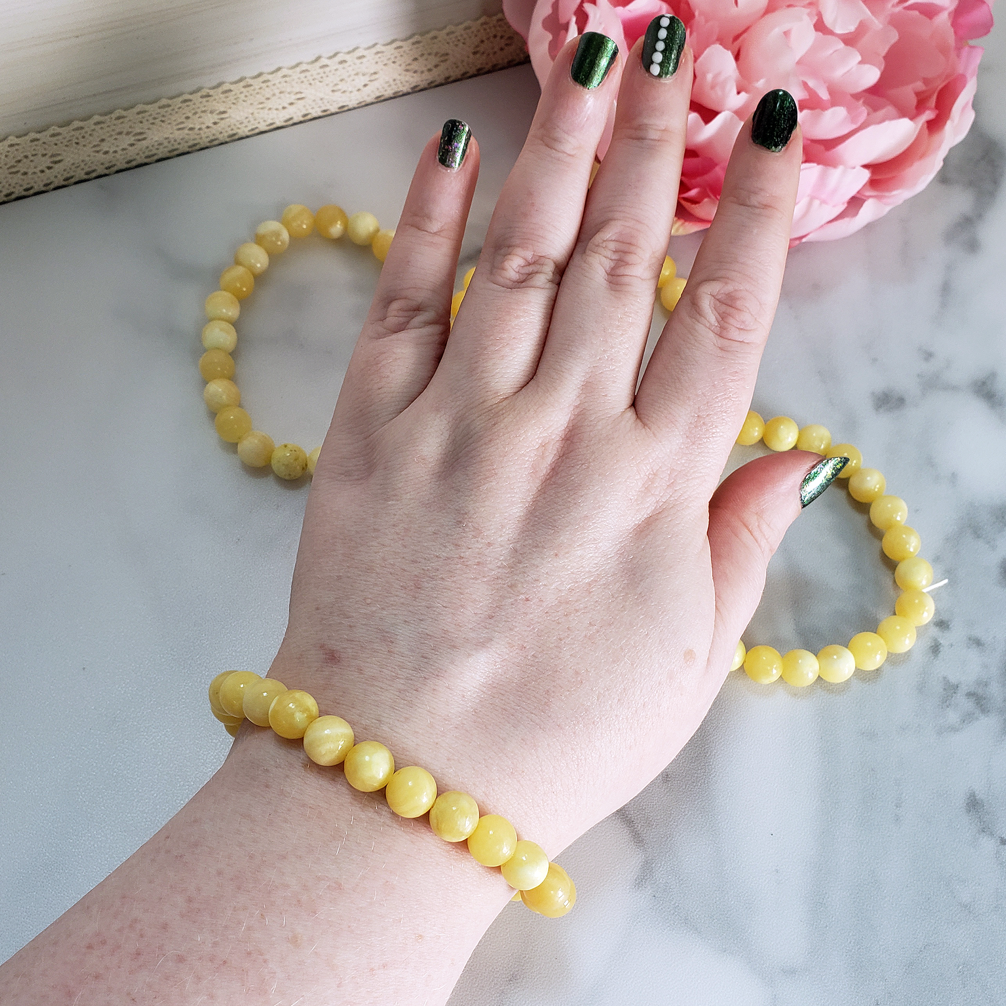 Yellow Calcite Gemstone 8mm Bead Bracelet - On Wrist Above More Bracelets