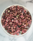 Rhodonite Crystal Pebbles Natural Gemstone Chips By the Ounce - Pink Rhodonite Gemstone Chips in White Ceramic Dish