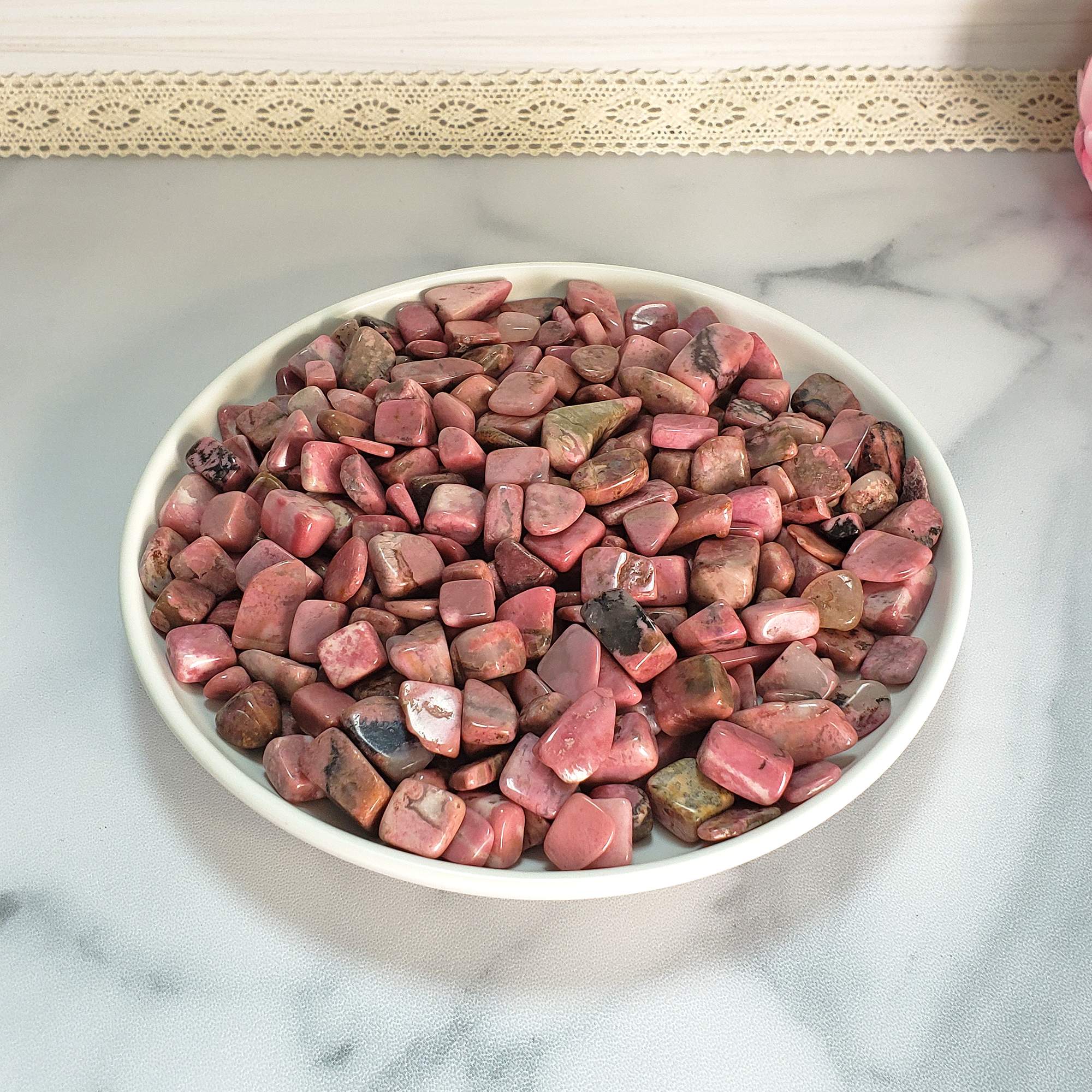 Rhodonite Crystal Pebbles Natural Gemstone Chips By the Ounce - Rhodonite Stone Chips in White Ceramic Bowl