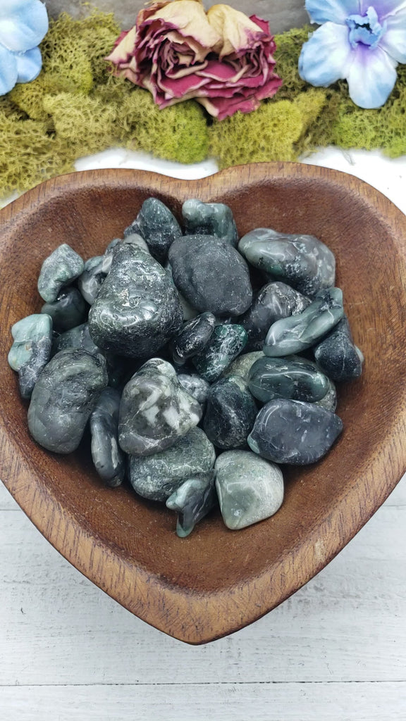 emerald in matrix stones in heart-shaped bowl