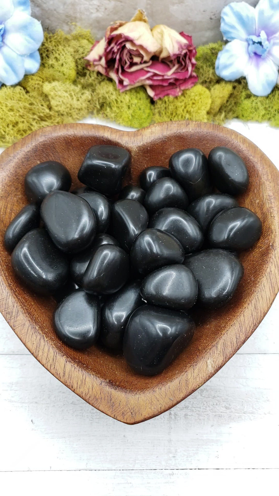 black agate stones in heart-shaped bowl
