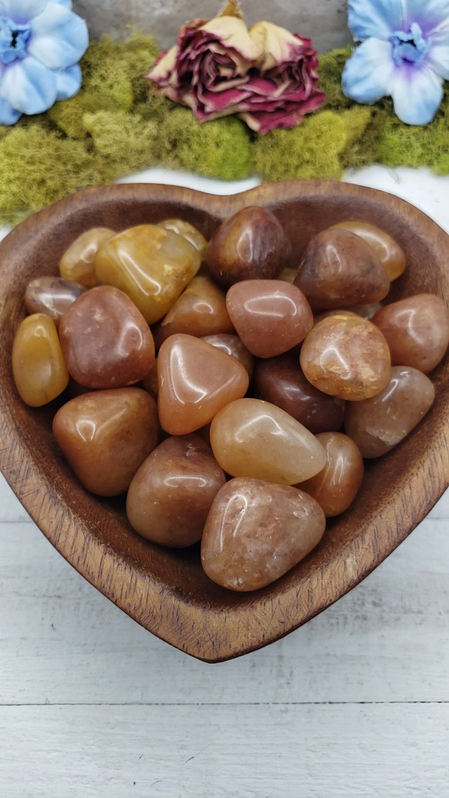 video of gold quartz crystals in heart-shaped bowl