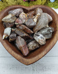 angel phantom quartz stones in heart-shaped bowl