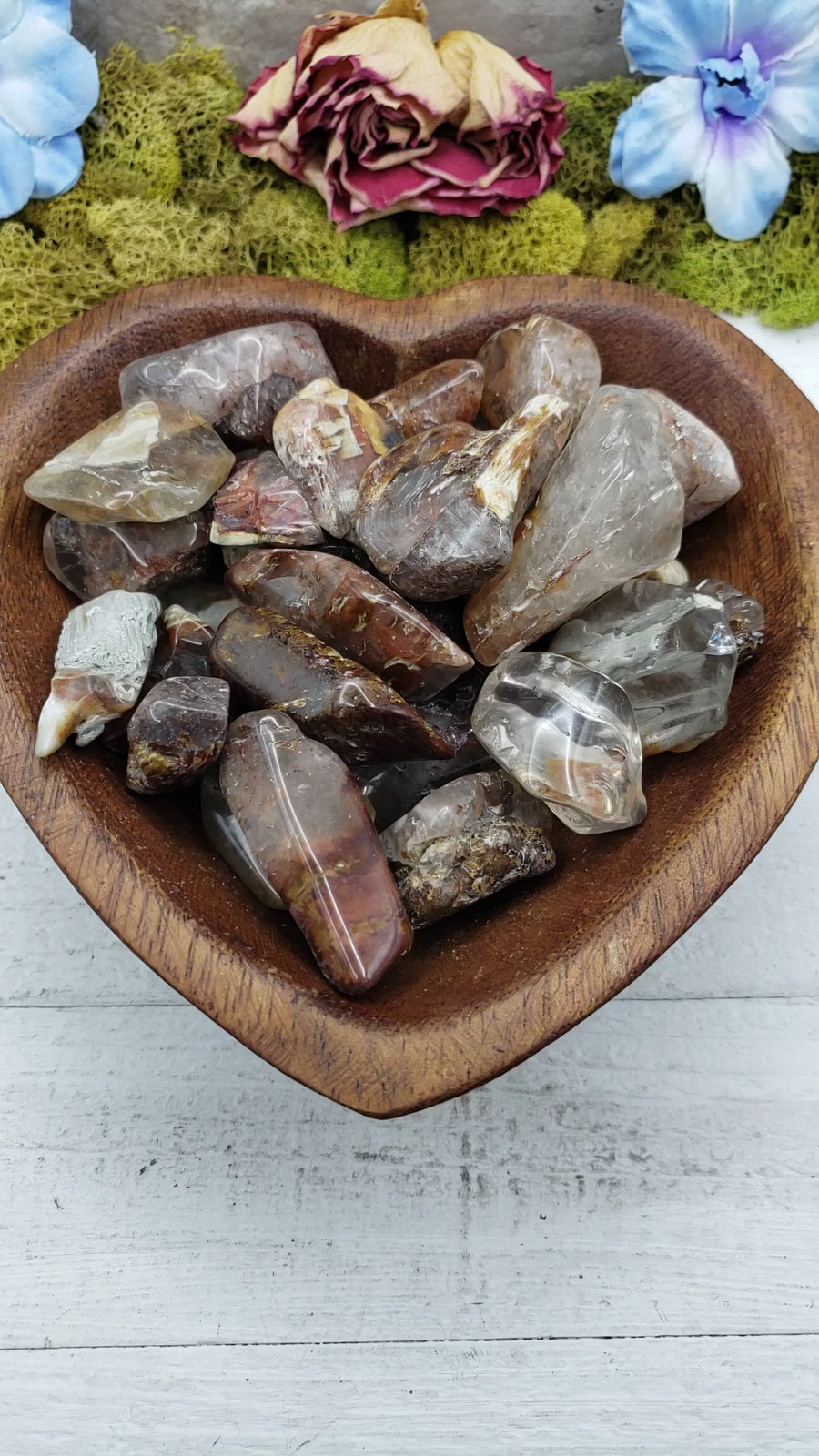 angel phantom quartz stones in heart-shaped bowl