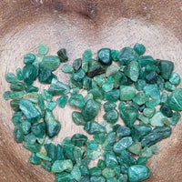emerald crystal chips being poured into bowl