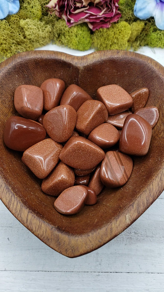 video of red goldstone crystals  in heart bowl