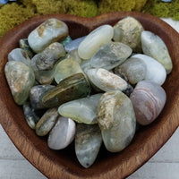 blue opal stones in heart-shaped bowl