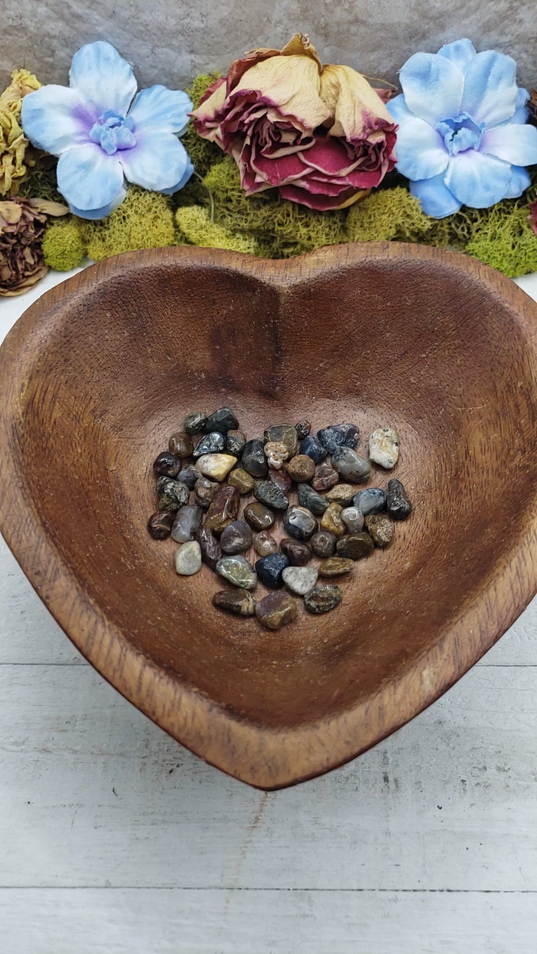 pietersite crystal chips being poured into a bowl