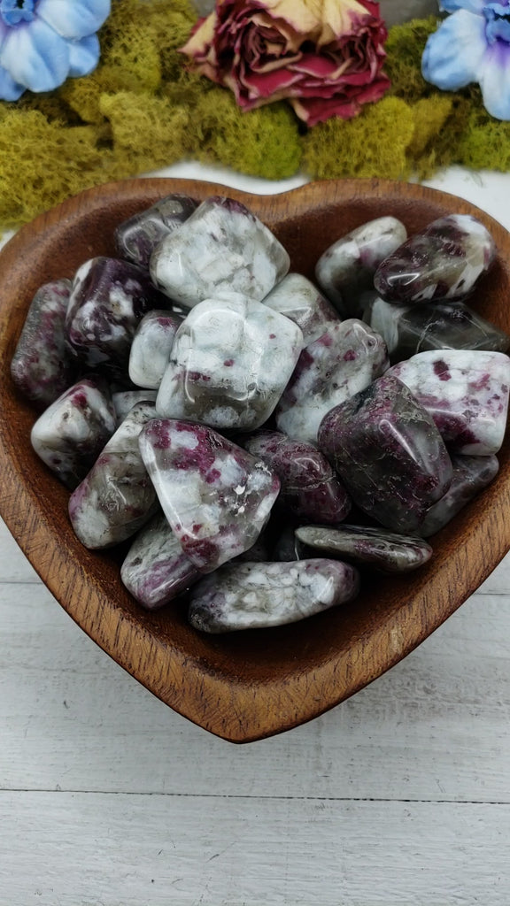 video of pink tourmaline in quartz crystals in heart bowl